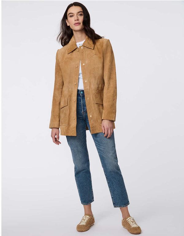 Luxe goat suede jacket with curved yoke stitching, flap pockets, belted waist, and polished snap closures. Modern Western-inspired elegance with tailored details.