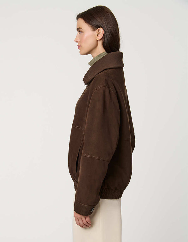 Oversized women’s suede bomber jacket in genuine suede with zip front and welt pockets for casual luxury.
