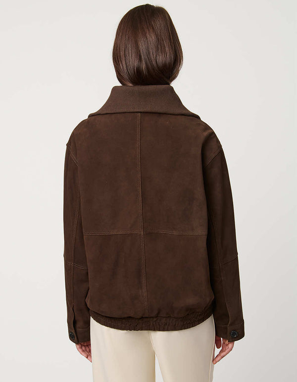 Oversized women’s suede bomber jacket in genuine suede with zip front and welt pockets for casual luxury.