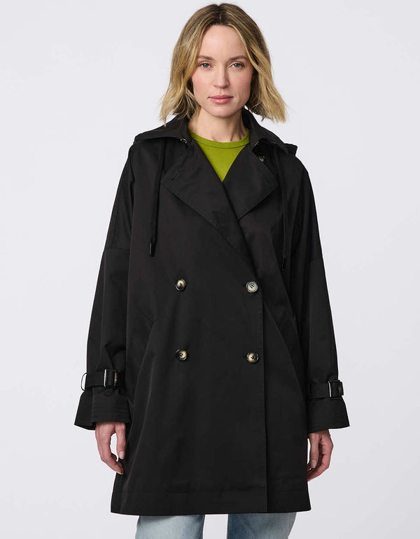 Oversized double-breasted trench with adjustable cuff straps, drawstring hood, and side button accents. Effortless, sophisticated layering piece.