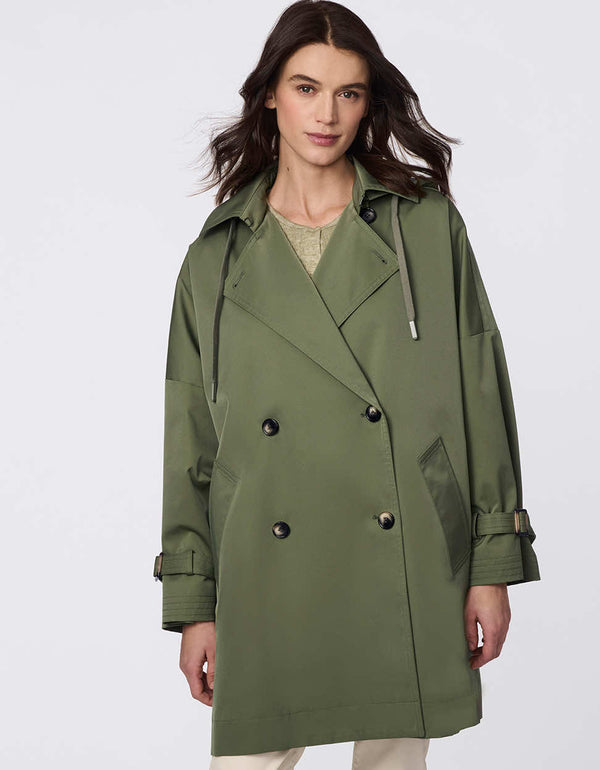 Oversized double-breasted trench with adjustable cuff straps, drawstring hood, and side button accents. Effortless, sophisticated layering piece.