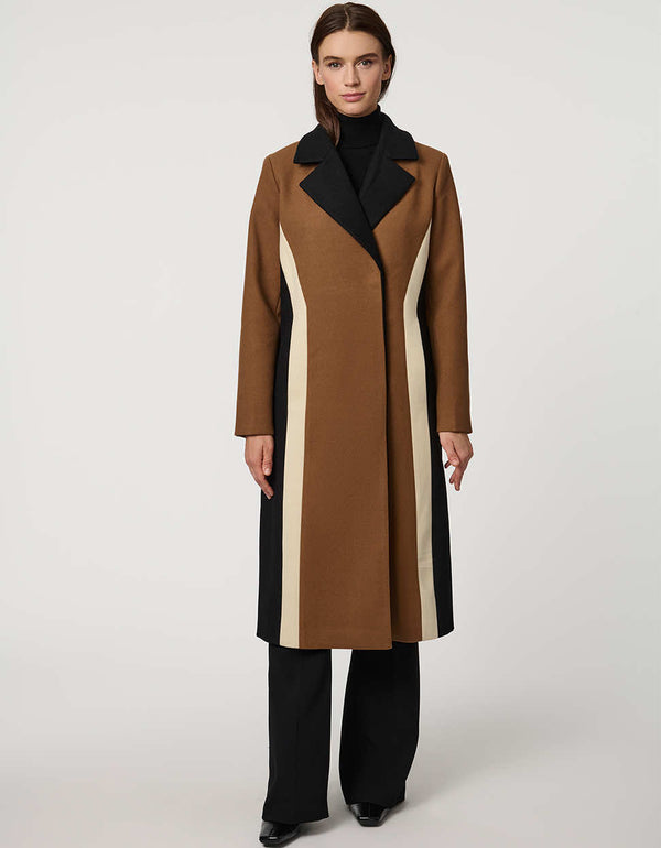 A woman in a tailored colorblock peacoat.
