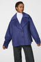 Double-breasted cropped wool jacket with oversized notch collar and cuffed sleeves for tailored layering.