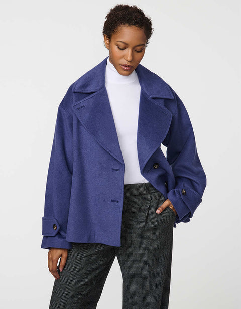 Double-breasted cropped wool jacket with oversized notch collar and cuffed sleeves for tailored layering.
