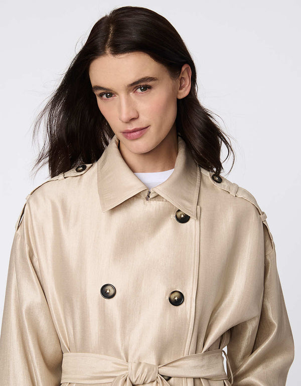 Double-breasted satin trench coat with self-tie belt, adjustable cuffs, and subtle shimmer. Elegant, functional, and sophisticated for any occasion.