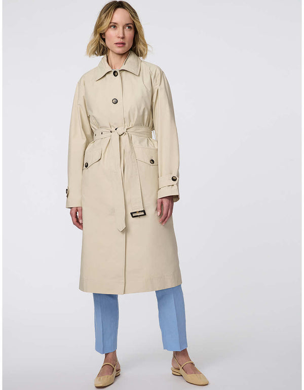 Modern trench coat with belted silhouette, contrast button details, removable quilted vest liner, and storm flap accents for versatile, seasonal styling