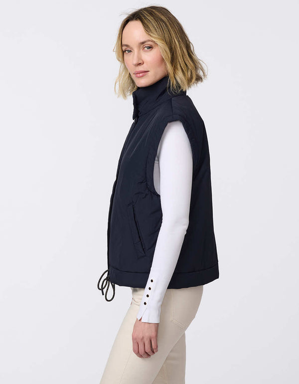 Lightweight puffer vest with adjustable hem and floral interior lining. Stylish, versatile layering piece perfect for on-the-go comfort.