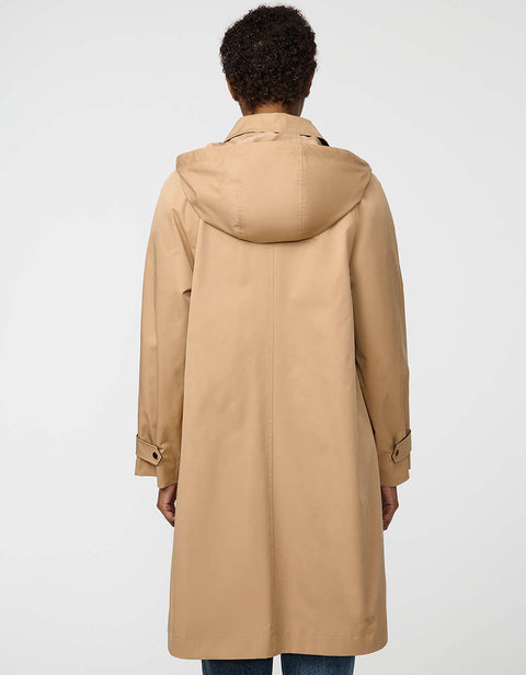 Oversized water-repellent trench coat with snap-off hood and button-flap zip closure, ideal for transitional layering.