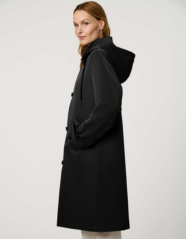 Women’s raincoat with hood, cinched waist, flap pockets, and zip-off hood in a tailored, versatile design.