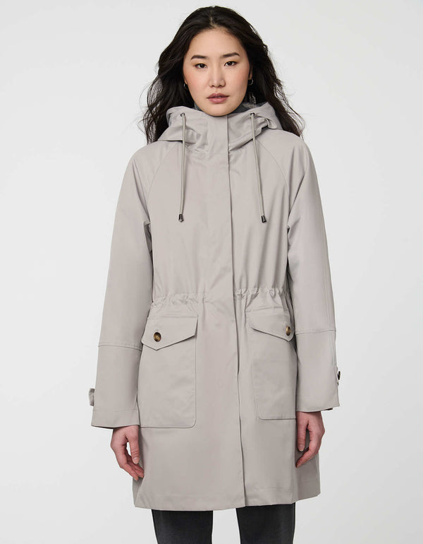 Elstead Raincoat for women featuring oversized patch pockets and adjustable waist for rainy days.