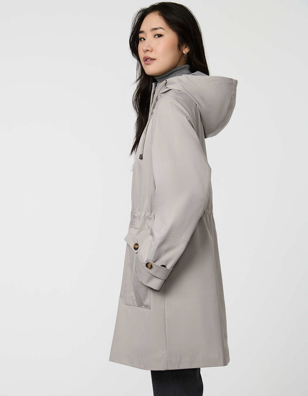 Elstead Raincoat for women featuring oversized patch pockets and adjustable waist for rainy days.