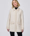 Textured tweed shacket with faux leather trim, hidden buttons, and lightweight design. Effortlessly stylish for layered looks and transitional seasons.