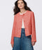 Cropped tweed jacket with collarless design, refined tailoring, and tonal buttons. Classic femininity with modern style, perfect for denim or dress pairings.
