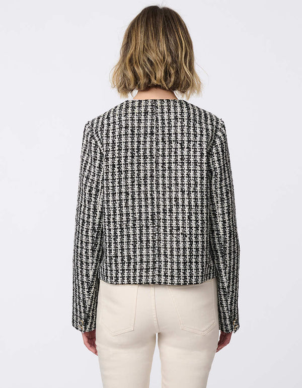 Cropped tweed jacket with collarless design, refined tailoring, and tonal buttons. Classic femininity with modern style, perfect for denim or dress pairings.