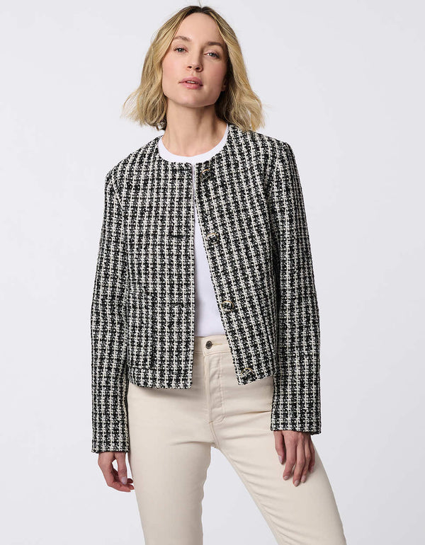 Cropped tweed jacket with collarless design, refined tailoring, and tonal buttons. Classic femininity with modern style, perfect for denim or dress pairings.