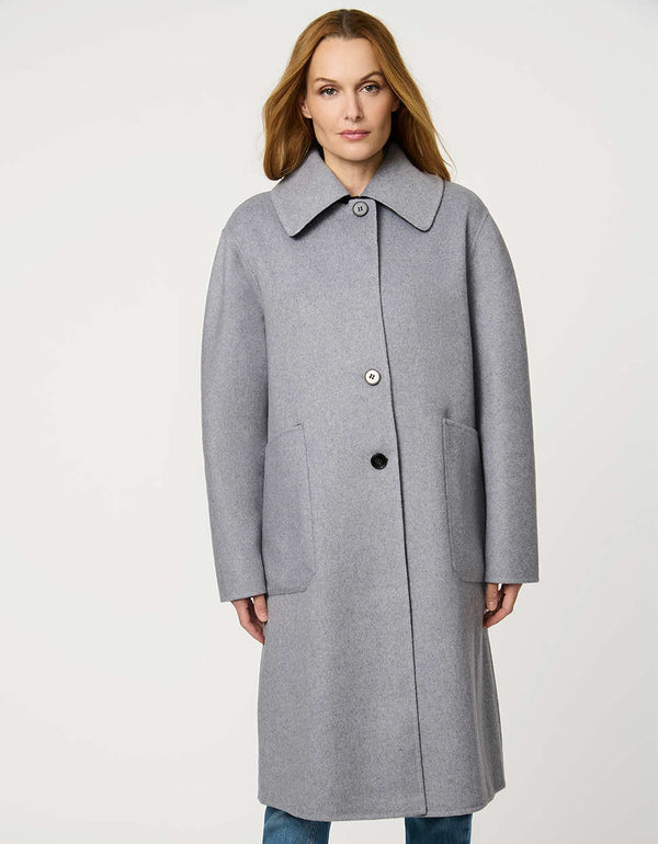 Women’s plaid wool coat with oversized calf-length fit, dramatic collar, and two-button single-breasted front.