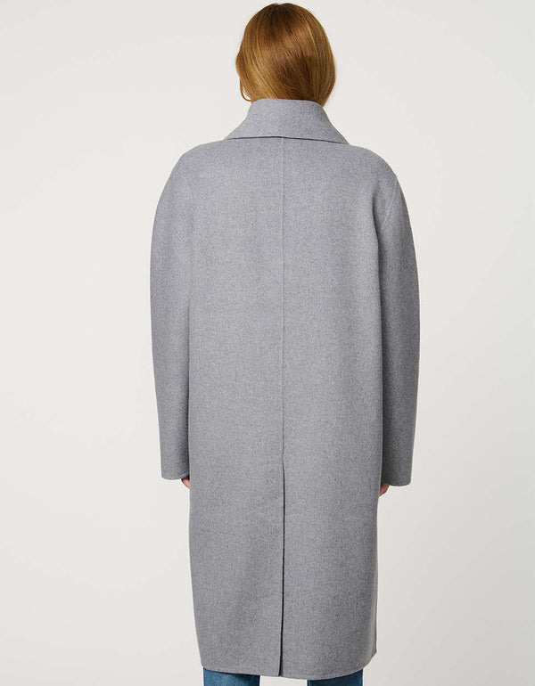 Women’s plaid wool coat with oversized calf-length fit, dramatic collar, and two-button single-breasted front.