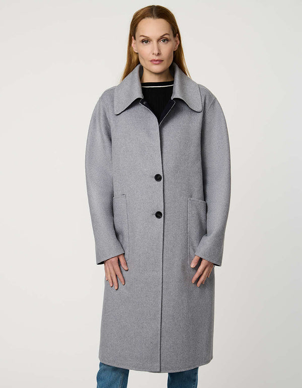 Women’s plaid wool coat with oversized calf-length fit, dramatic collar, and two-button single-breasted front.
