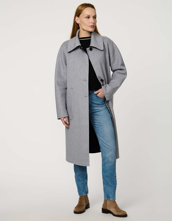 Women’s plaid wool coat with oversized calf-length fit, dramatic collar, and two-button single-breasted front.