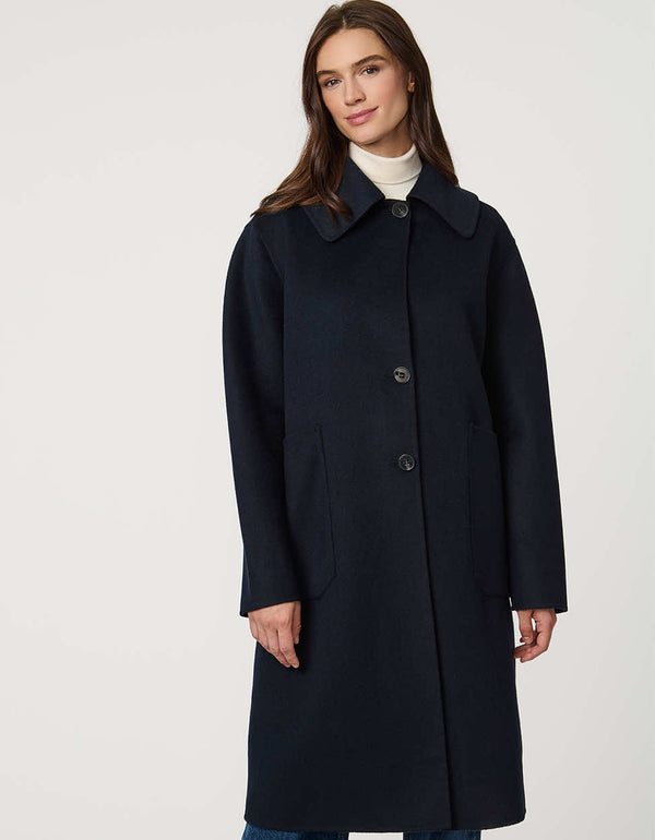 Women’s plaid wool coat with oversized calf-length fit, dramatic collar, and two-button single-breasted front.