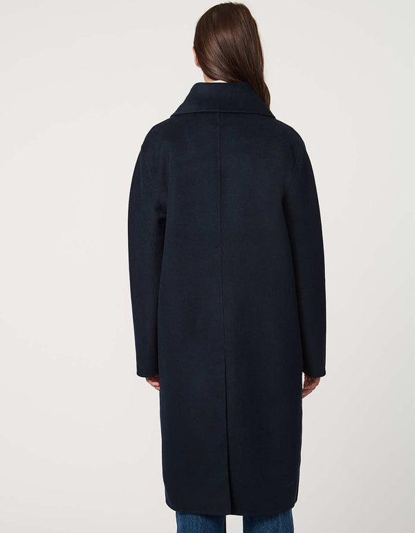 Women’s plaid wool coat with oversized calf-length fit, dramatic collar, and two-button single-breasted front.