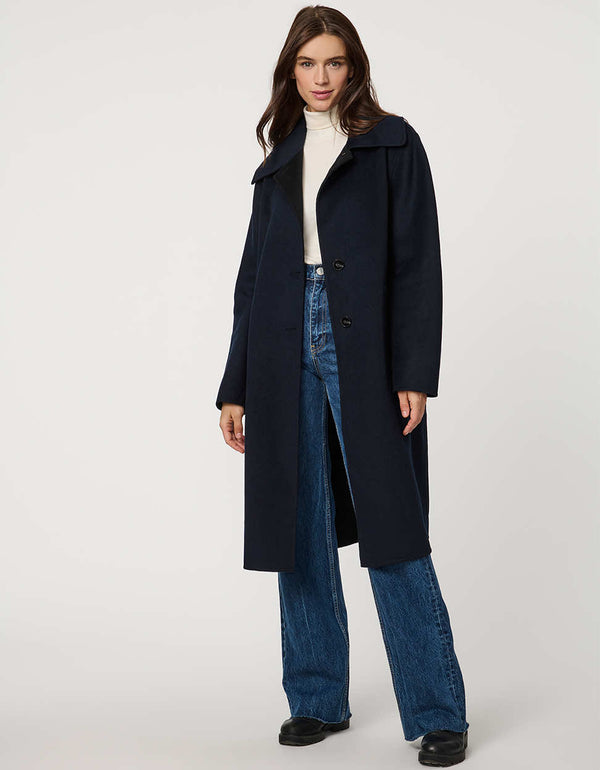 Women’s plaid wool coat with oversized calf-length fit, dramatic collar, and two-button single-breasted front.