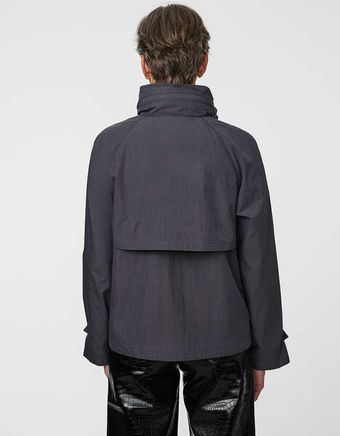 Waist-length water-repellent jacket with roll-away hood and patch pockets, designed for everyday layering.