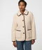 Plush sherpa coat with contrast trim, tortoise shell buttons, and patch pockets for cozy styling.