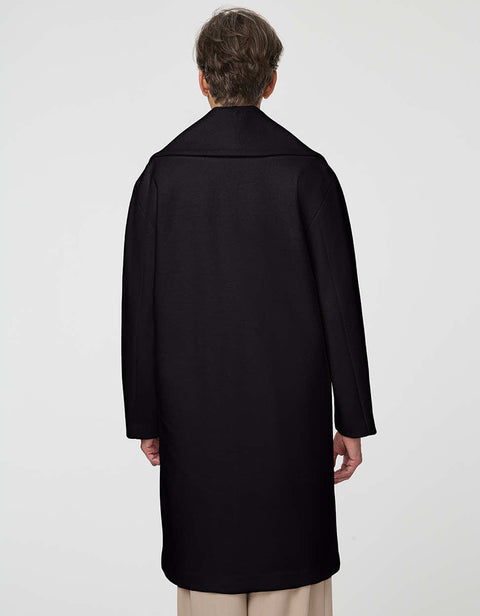 Calf-length double-breasted wool coat with oversized lapels, offering timeless sophistication and warmth.