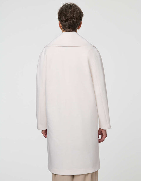 Calf-length double-breasted wool coat with oversized lapels, offering timeless sophistication and warmth.