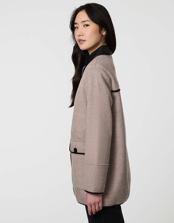 Pennlock Utility Coat for women blending wool-feel knit and faux leather with patch pockets.