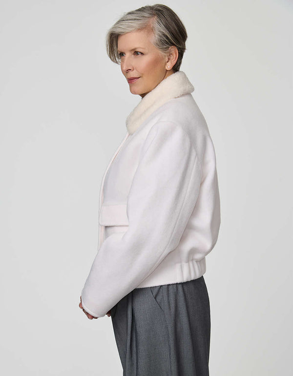 Cropped Aubrey Jacket in textured sherpa with flap pockets, ideal for layering over high-rise denim.