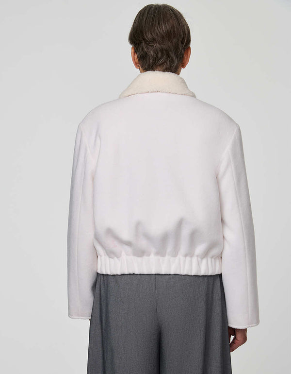 Cropped Aubrey Jacket in textured sherpa with flap pockets, ideal for layering over high-rise denim.