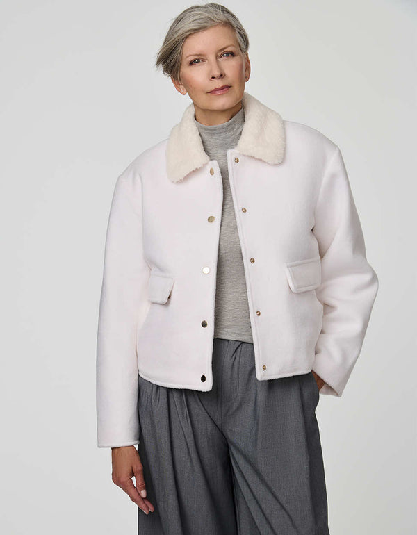 Cropped Aubrey Jacket in textured sherpa with flap pockets, ideal for layering over high-rise denim.