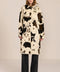 Women's faux calf hair car coat with oversized collar, button-front closure and cuff-tab details.