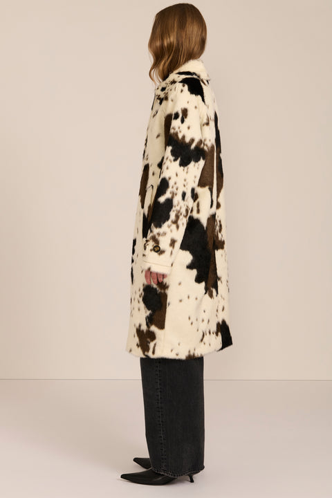 Women's faux calf hair car coat with oversized collar, button-front closure and cuff-tab details.