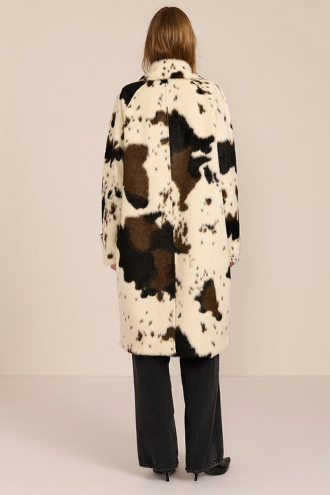 Women's faux calf hair car coat with oversized collar, button-front closure and cuff-tab details.