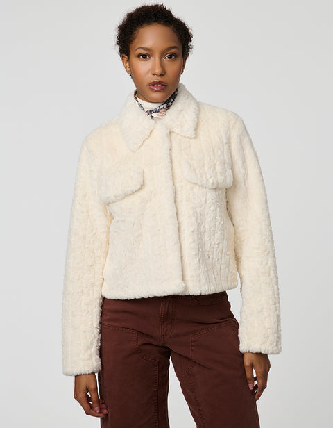 Cropped groove-textured faux fur jacket with button front and flap chest pockets for stylish layering.