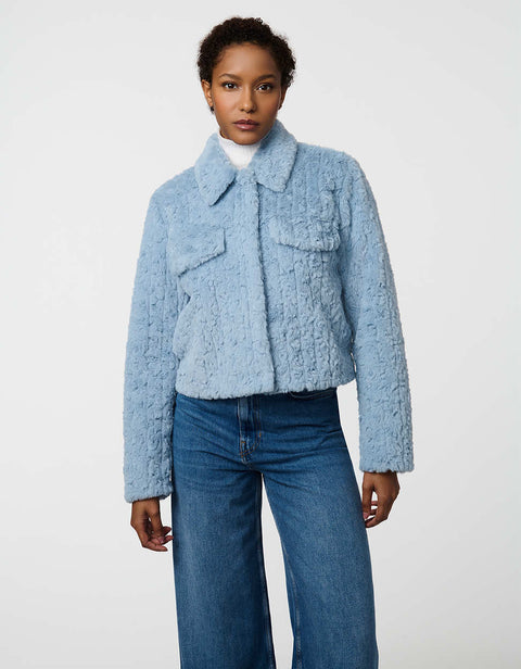 Cropped groove-textured faux fur jacket with button front and flap chest pockets for stylish layering.