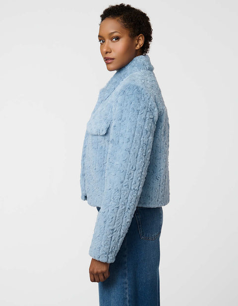 Cropped groove-textured faux fur jacket with button front and flap chest pockets for stylish layering.