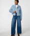 Cropped groove-textured faux fur jacket with button front and flap chest pockets for stylish layering.