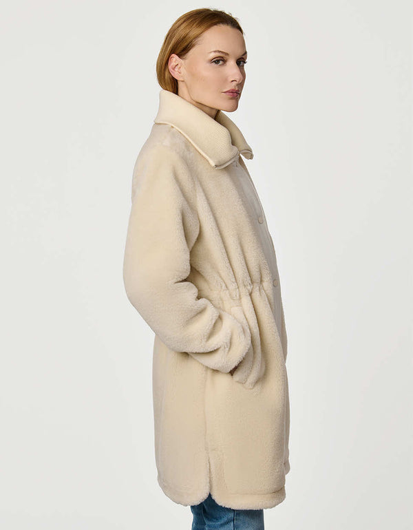 Plush Briarfield Sherpa Anorak featuring zip-up collar, cinched waist, and modern silhouette.