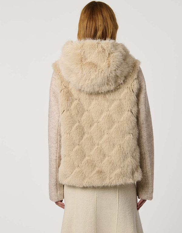 Hip-length faux fur coat with jacquard diamond pattern, wool sleeves, cozy hood, and zip closure for modern style.
