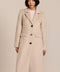 Women’s knee-length wool coat with tailored darts, patch pockets, and single-breasted three-button front.