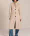 Women’s knee-length wool coat with tailored darts, patch pockets, and single-breasted three-button front.