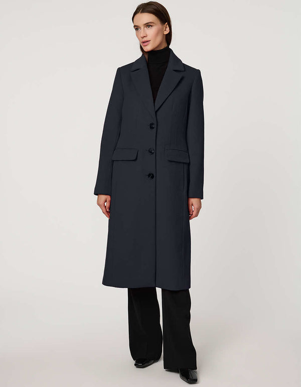 Women’s knee-length wool coat with tailored darts, patch pockets, and single-breasted three-button front.