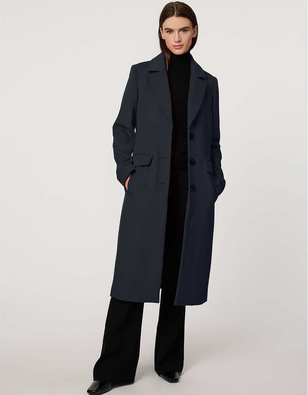 Women’s knee-length wool coat with tailored darts, patch pockets, and single-breasted three-button front.