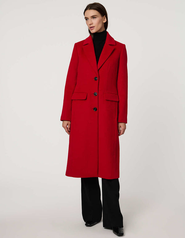 Women’s knee-length wool coat with tailored darts, patch pockets, and single-breasted three-button front.