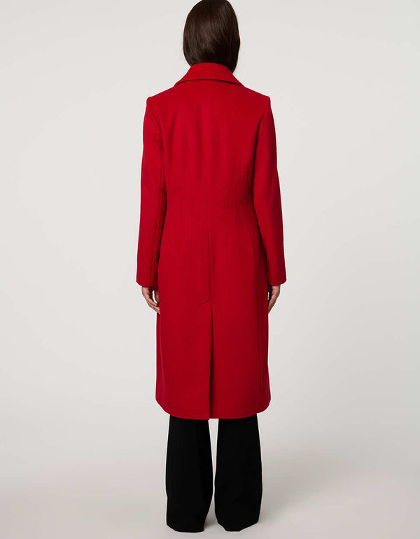 Women’s knee-length wool coat with tailored darts, patch pockets, and single-breasted three-button front.