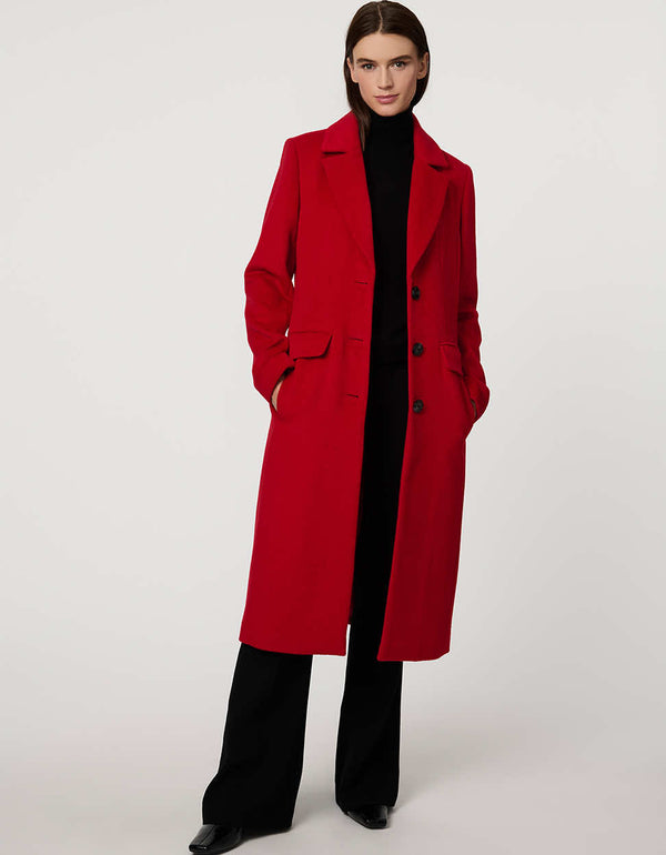 Women’s knee-length wool coat with tailored darts, patch pockets, and single-breasted three-button front.